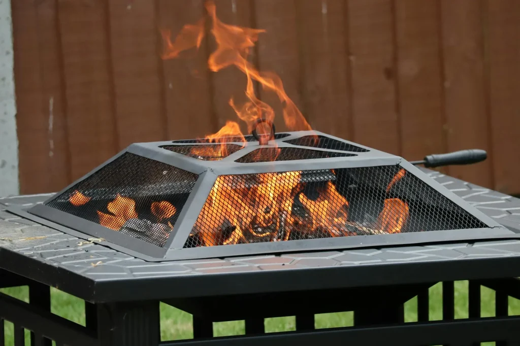 Chiminea with fire burning on a garden patio