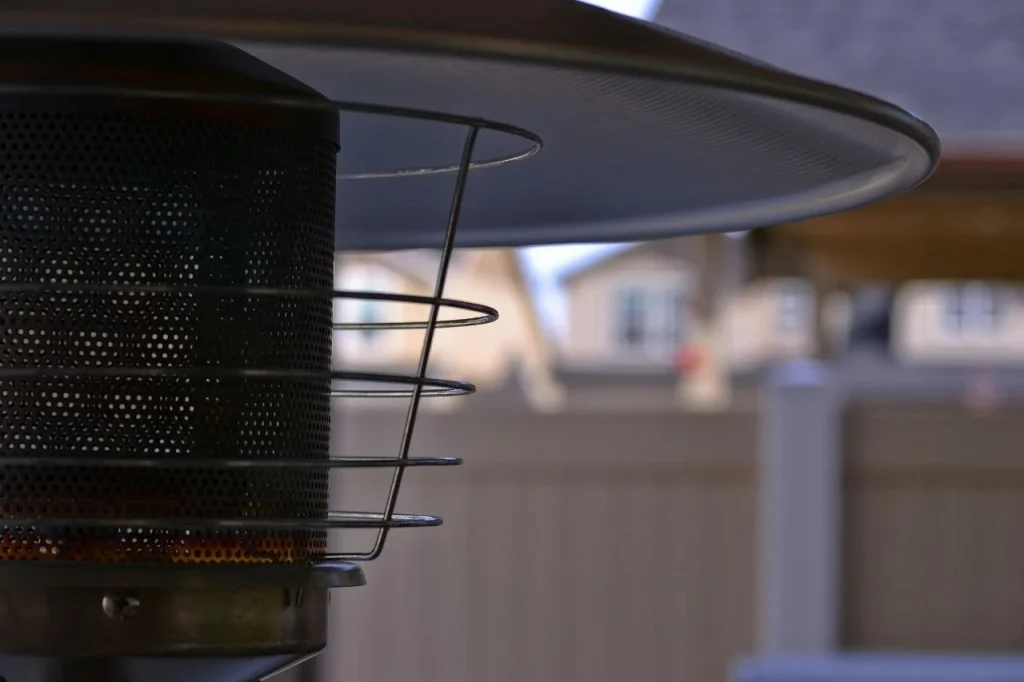 Close-up of a patio gas heater showing the heating element and reflector — best patio heaters 2026 UK