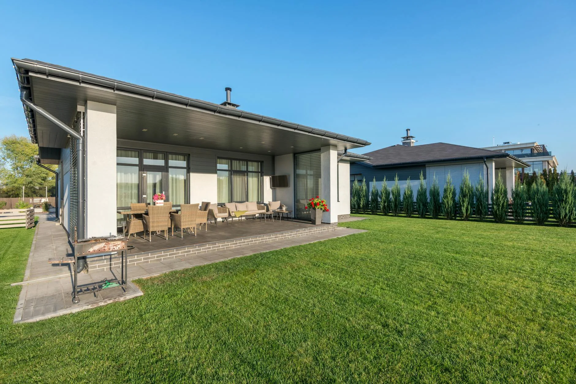 Clean patio slabs in a well-maintained UK garden