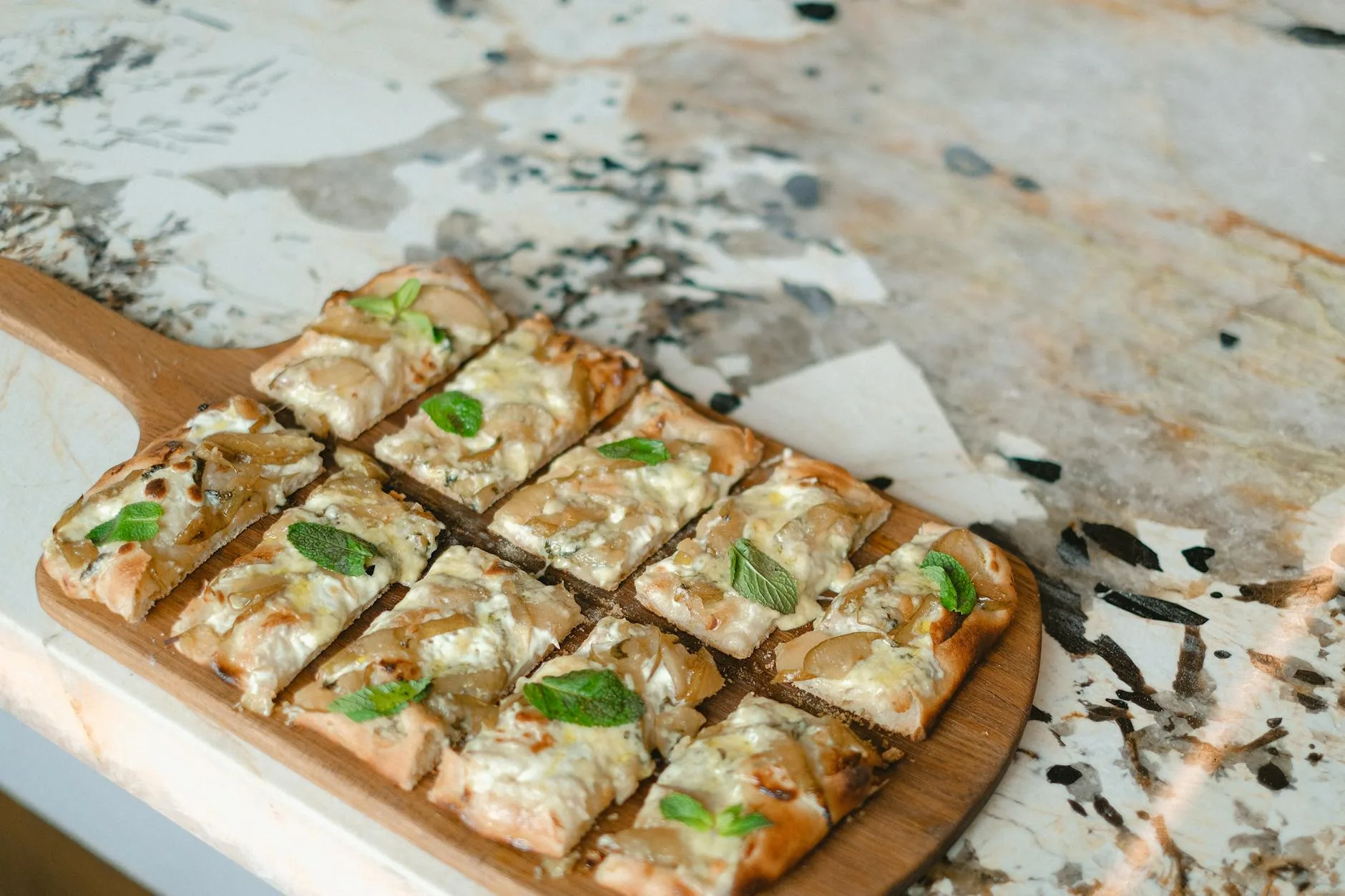 Fresh homemade pizza on a wooden board with rustic background