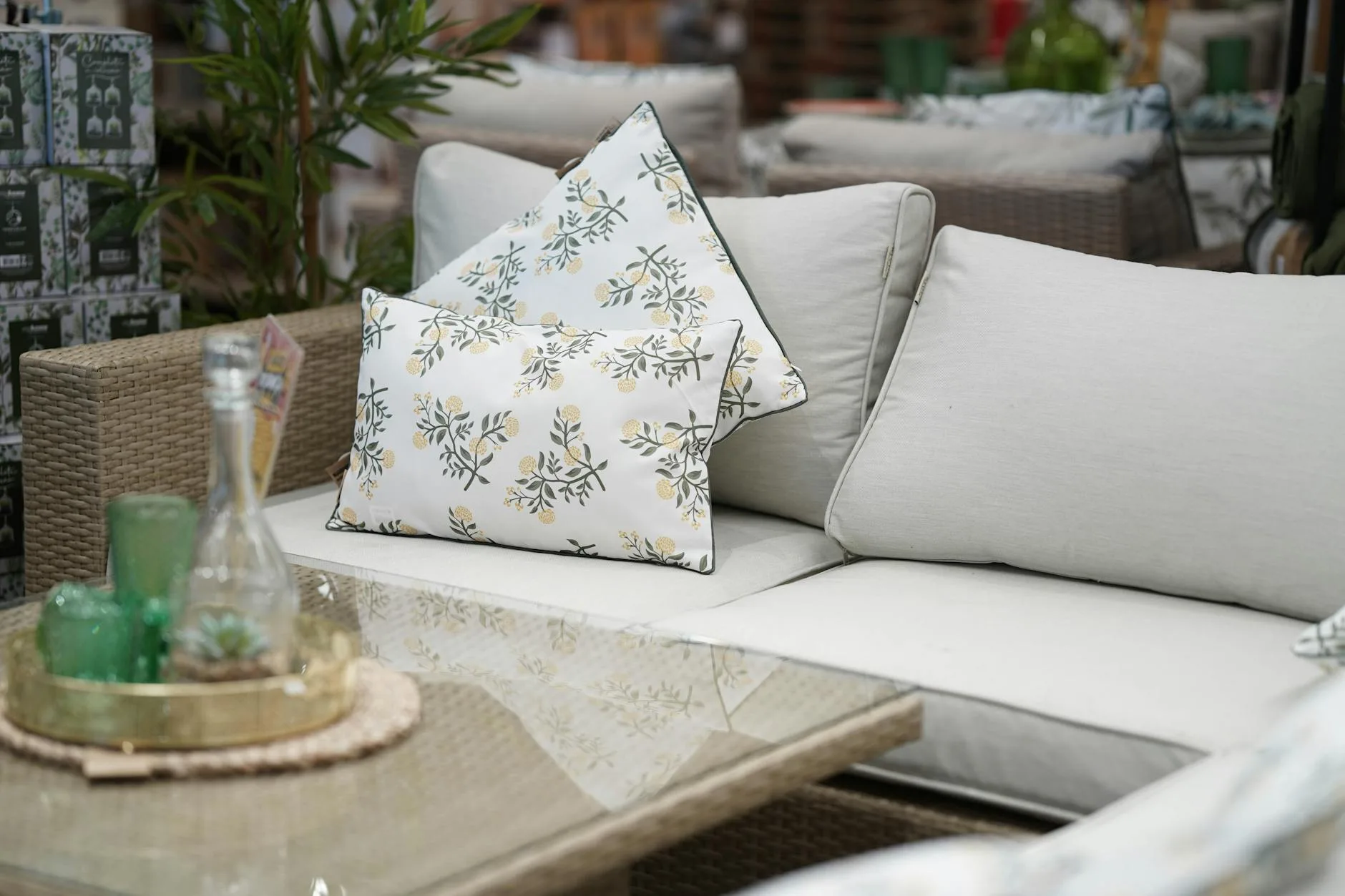 Rattan garden furniture set with cushions on a patio