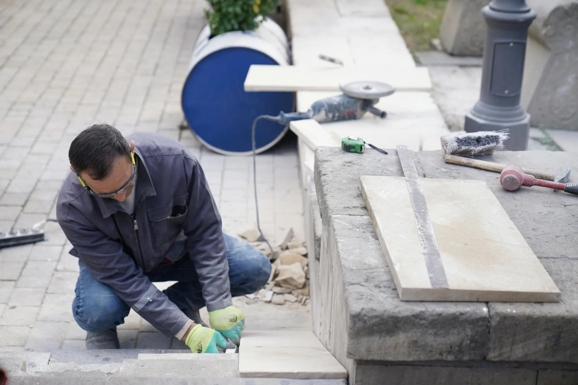 Laying paving slabs with construction tools