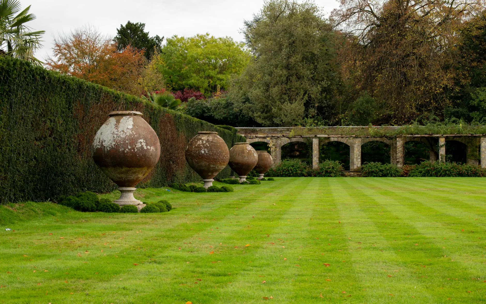 Neatly striped lawn in an English garden with patio