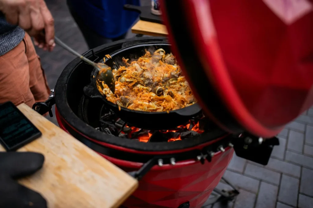 Premium kamado-style barbecue grill on an outdoor patio setup