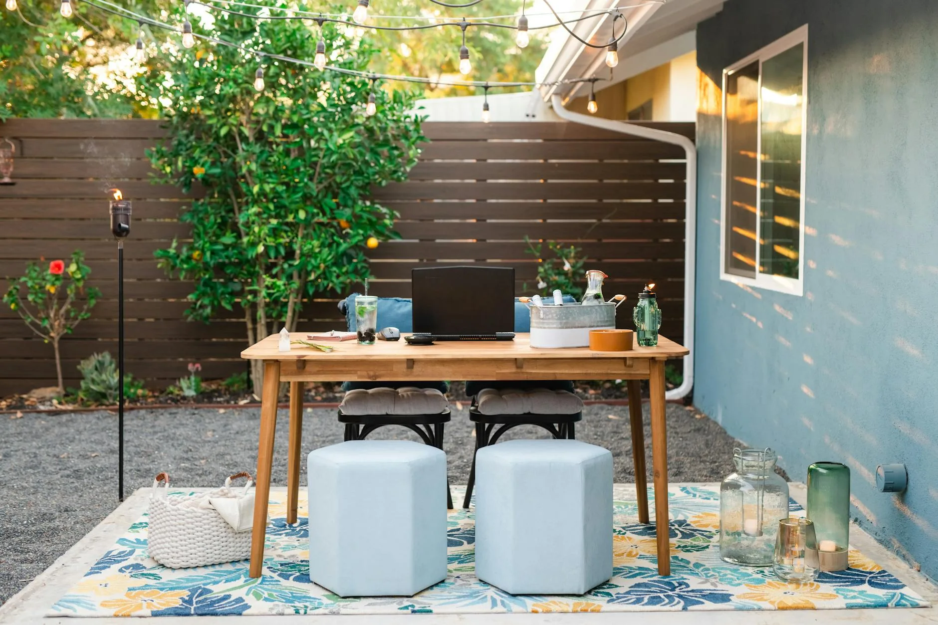 Cosy small garden patio with outdoor furniture and plants