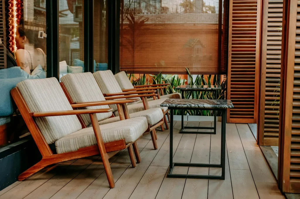 Wooden garden furniture set on a patio in a sunny garden