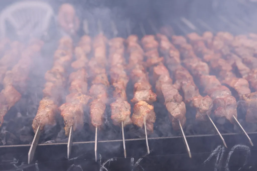 Barbecue grill with food cooking in a garden