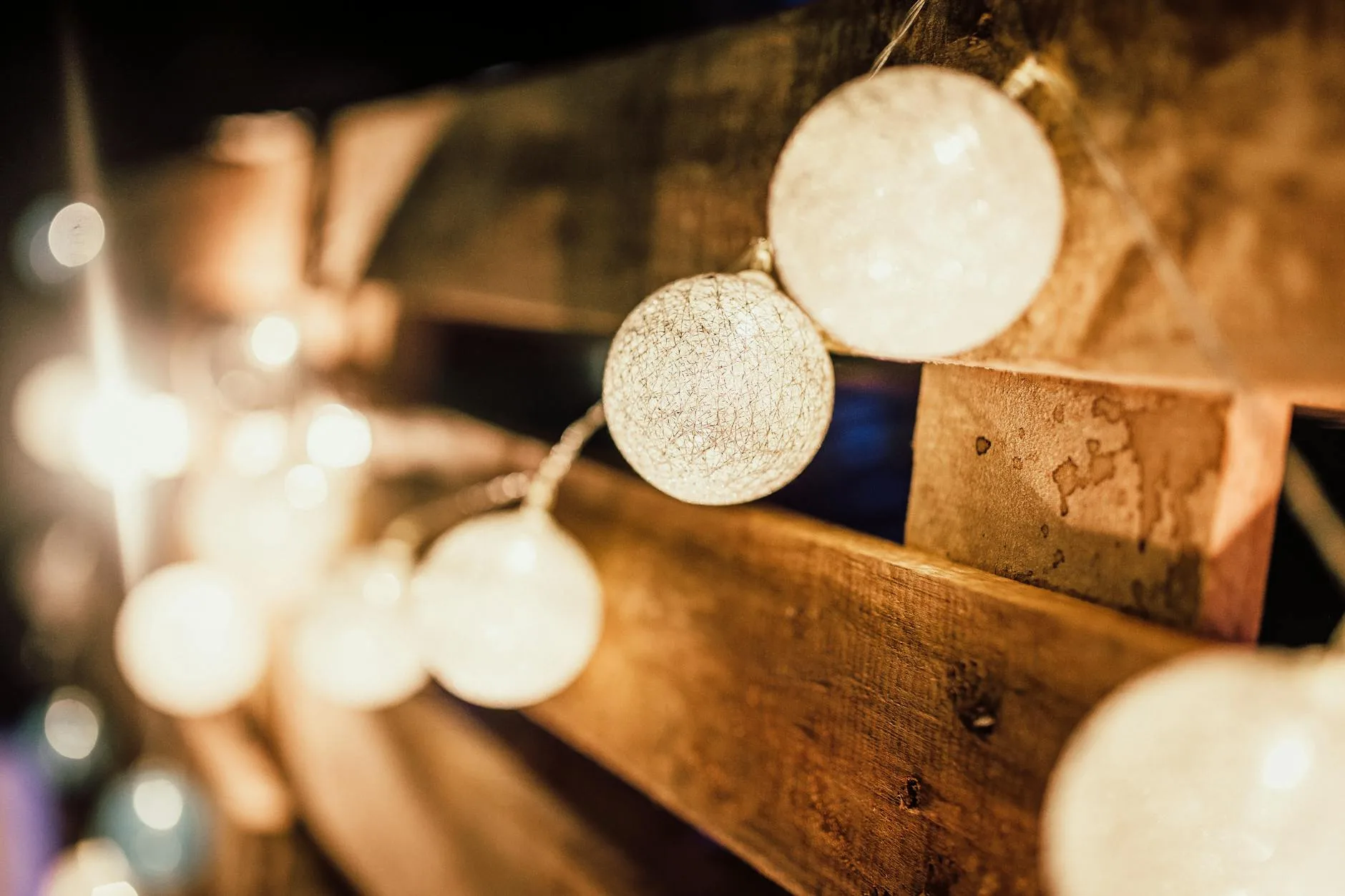 Festoon string lights creating warm atmosphere on a patio