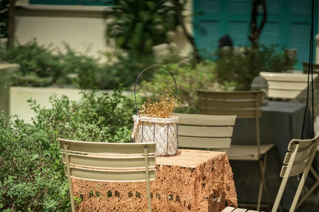 Small cosy patio with bistro table and plants