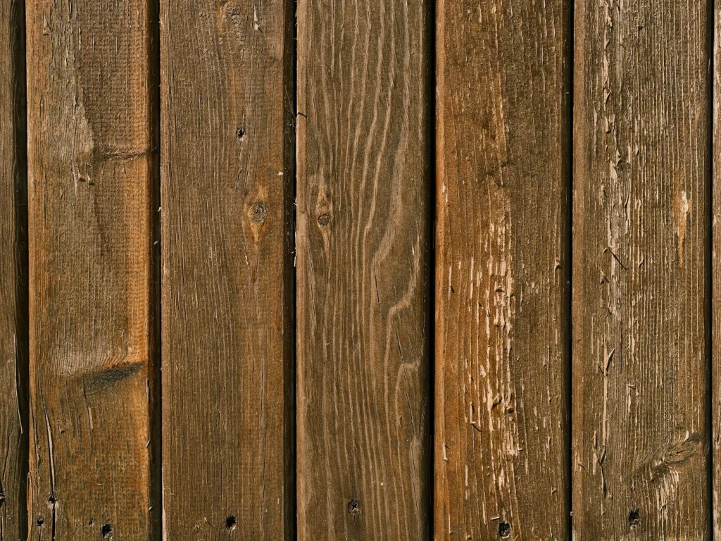 Close-up of wooden garden fence panels in brown timber
