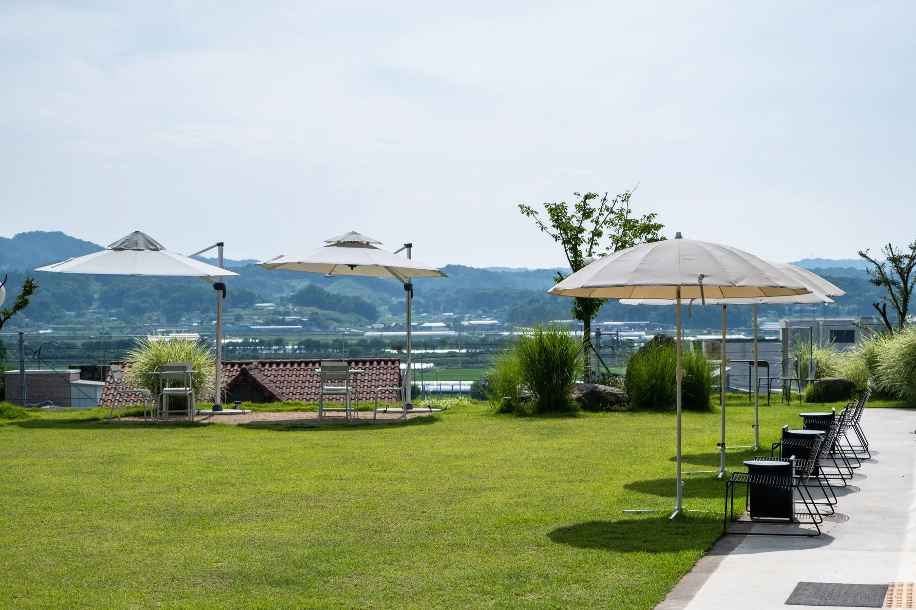 Garden parasols shading outdoor seating on a sunny patio