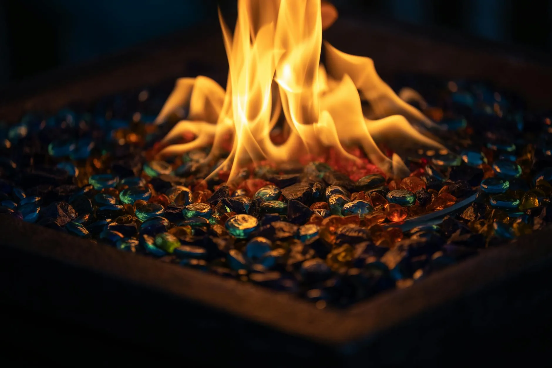Gas fire pit table on an outdoor patio seating area