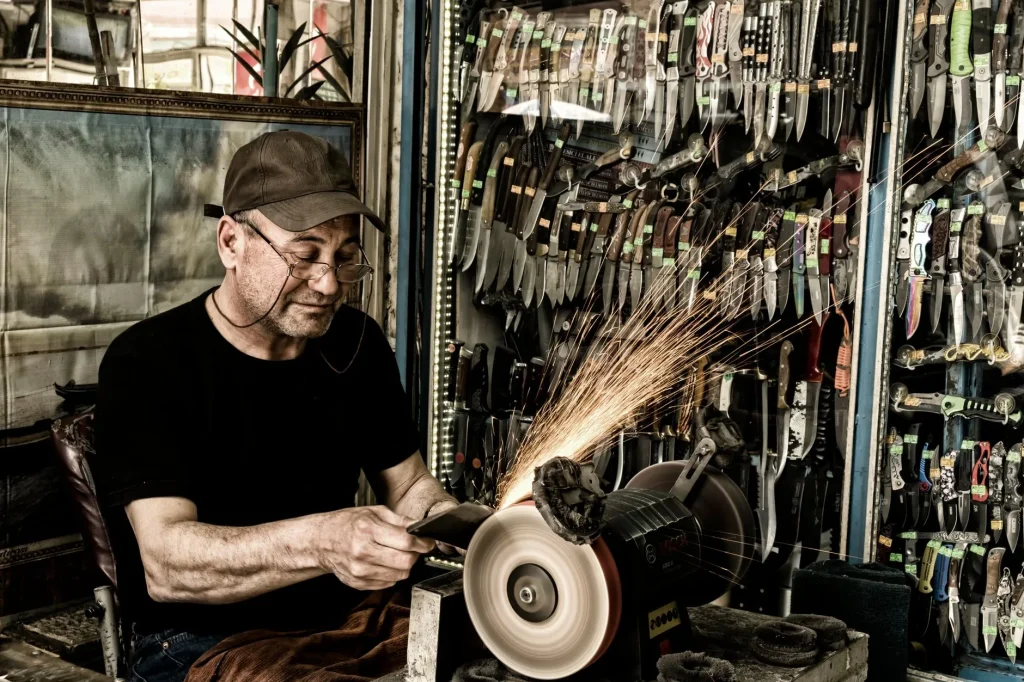 Secateurs and garden tools being sharpened on a workbench
