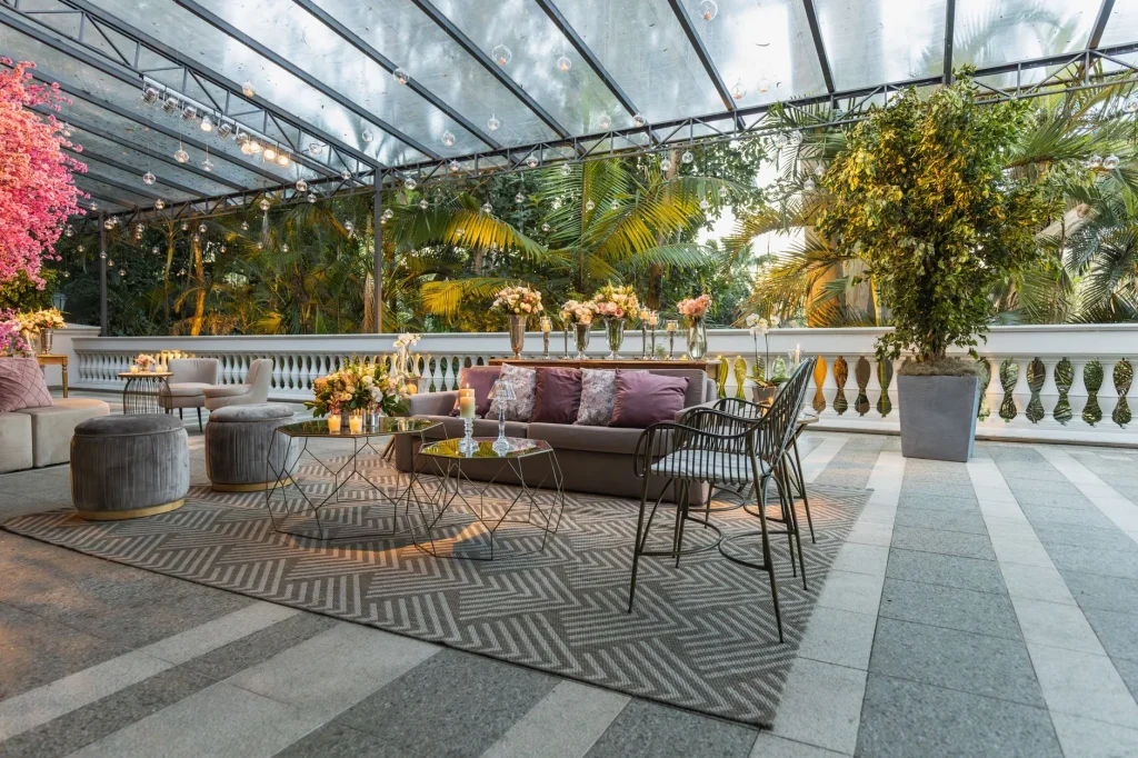 Patterned outdoor rug under patio furniture in a garden seating area