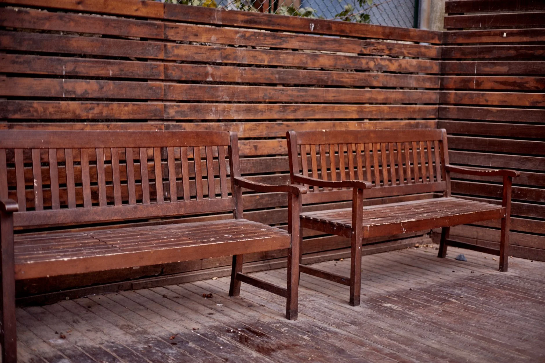 Weatherproofed wooden garden bench outdoors