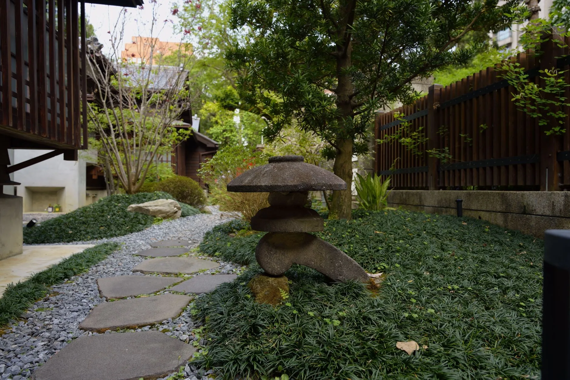 Stepping stone path through gravel in a Japanese-inspired garden